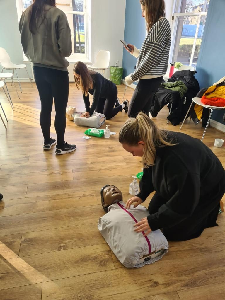 CPR and defibrillator (AED) practice on a manikin